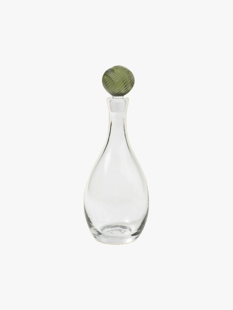 Clear glass bottle with a textured green glass stopper.