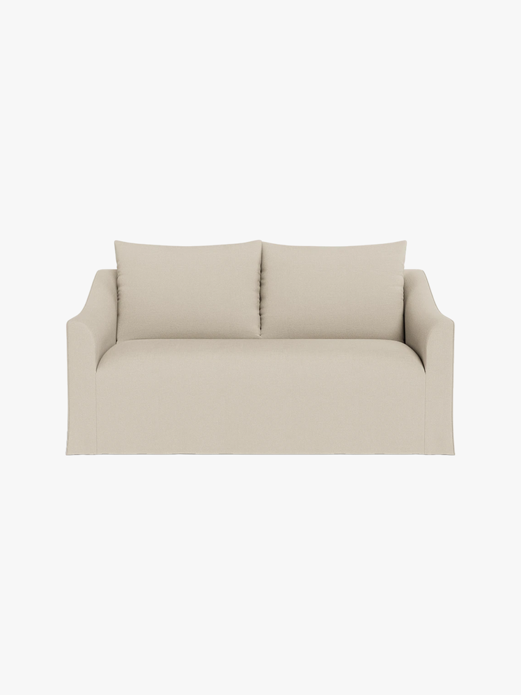 Dixon loveseat couch with a beige slipcover.