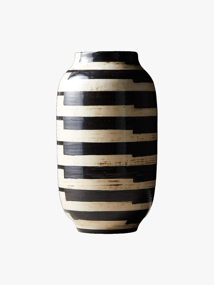 Urnshaped vase with black and white stripes of glaze.