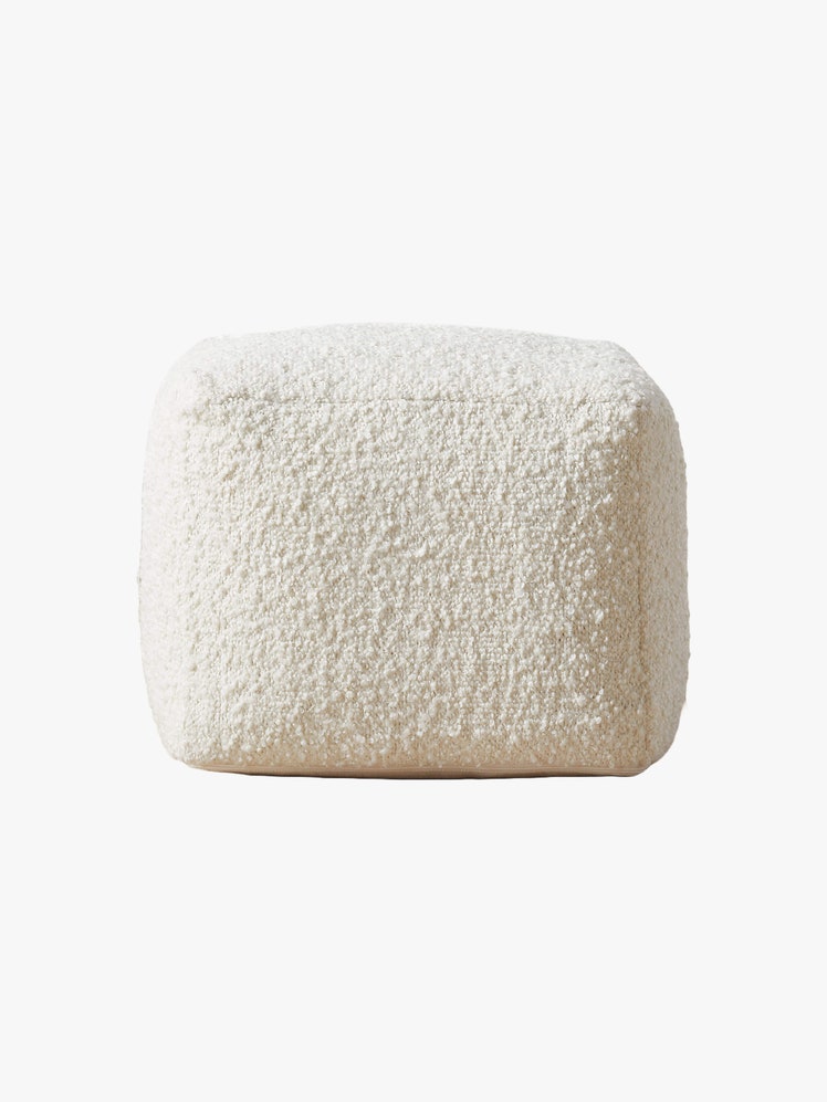 White square shaped boucle pouf.