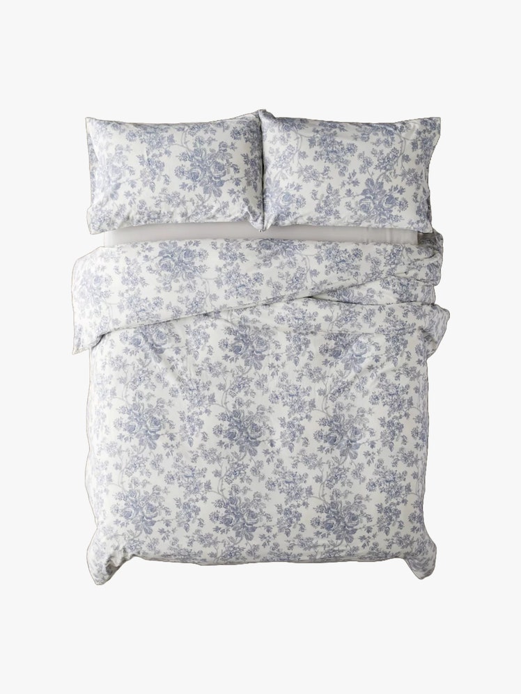 Duvet set featuring a printed blue floral toile motif allover.