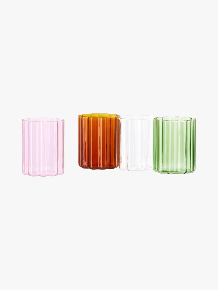 Set of four handblown borosilicate glasses in green clear pink and orange.