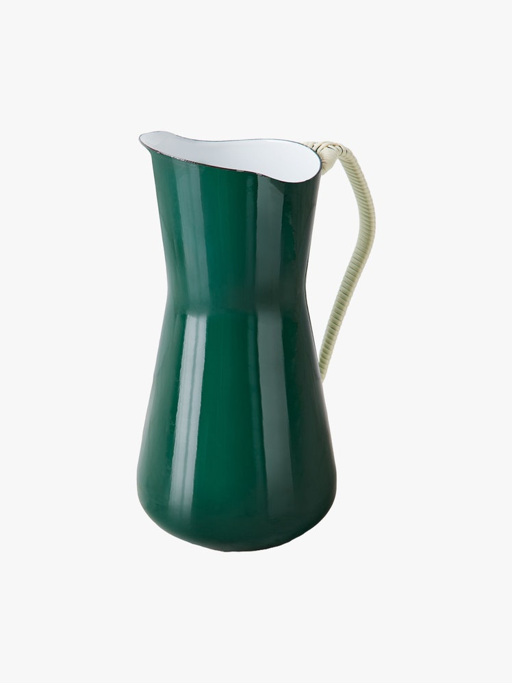 Water pitcher with elegant curves and a glossy green enameled carbon steel outside white inside and black rim.