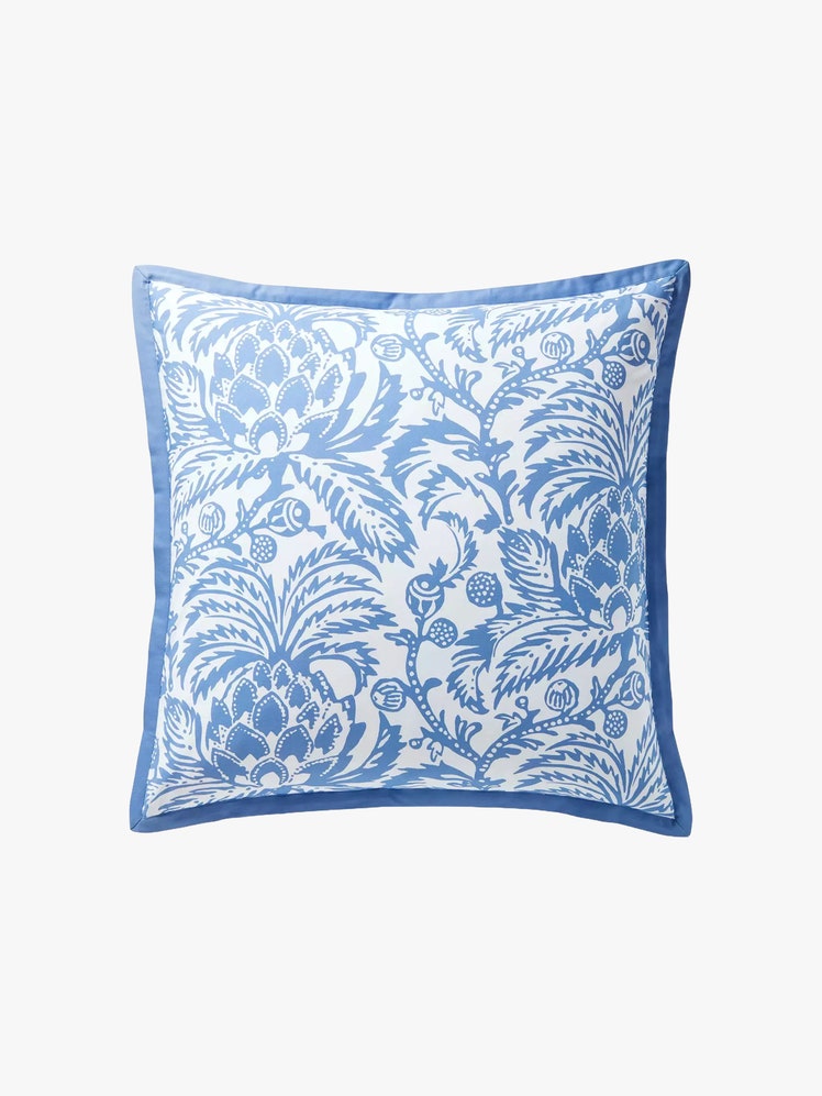 Square pillow sham with a blue botanical design on it featuring artichokes.