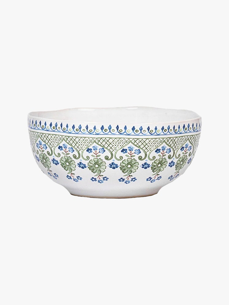 Ceramic bowl with blue and green floral pattern along the rim.