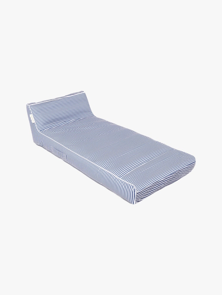 Blue and white striped chaise loungeshaped pool float.