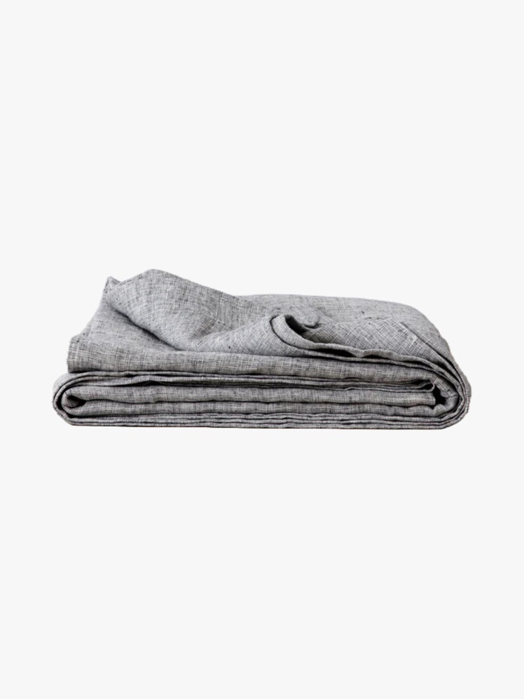 Gray chambray linen blanket folded up.