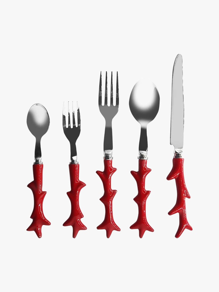 Silver cutlery set with red coralshaped handles.