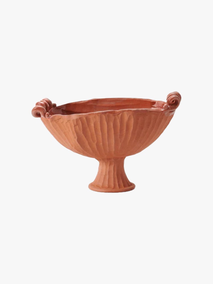 Terracotta Pedestal Bowl with ridged texture and curled handles.