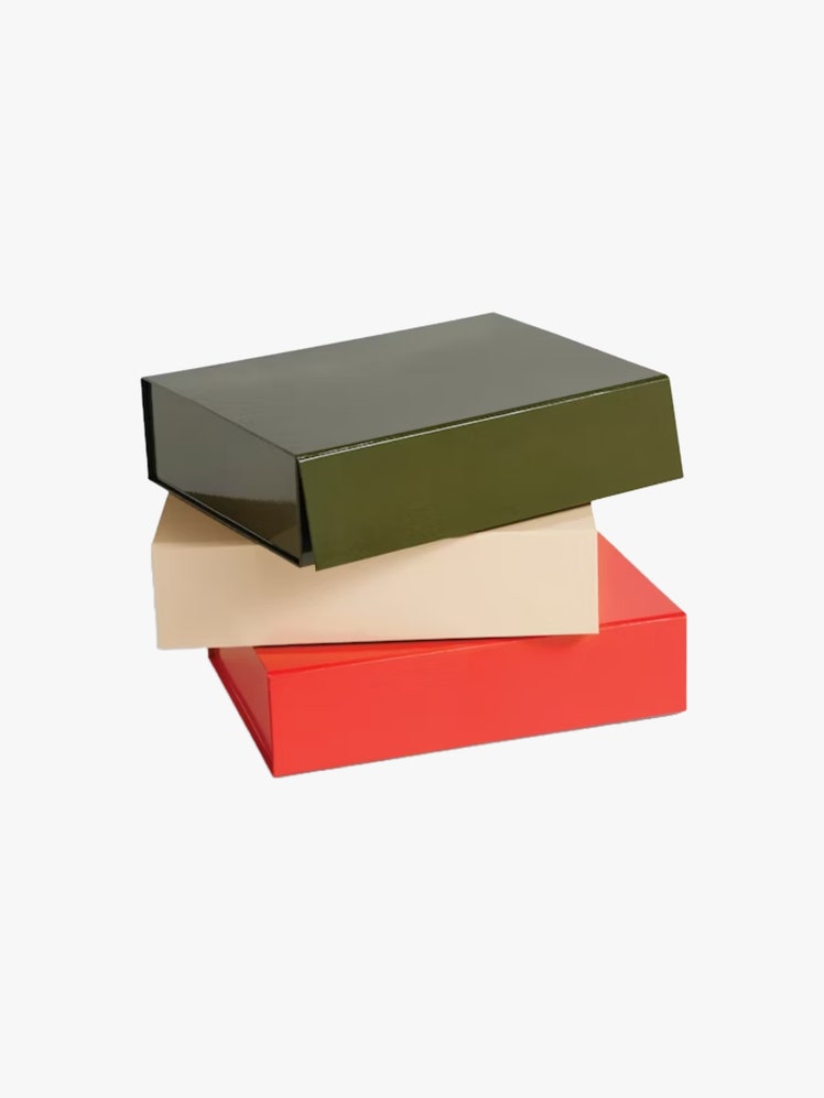 Stack of three colored storage boxes in red white and green.