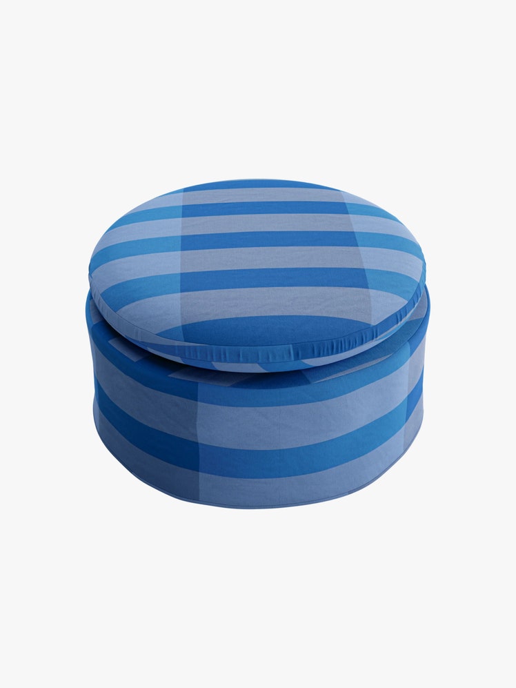 Striped blue circular ottoman.