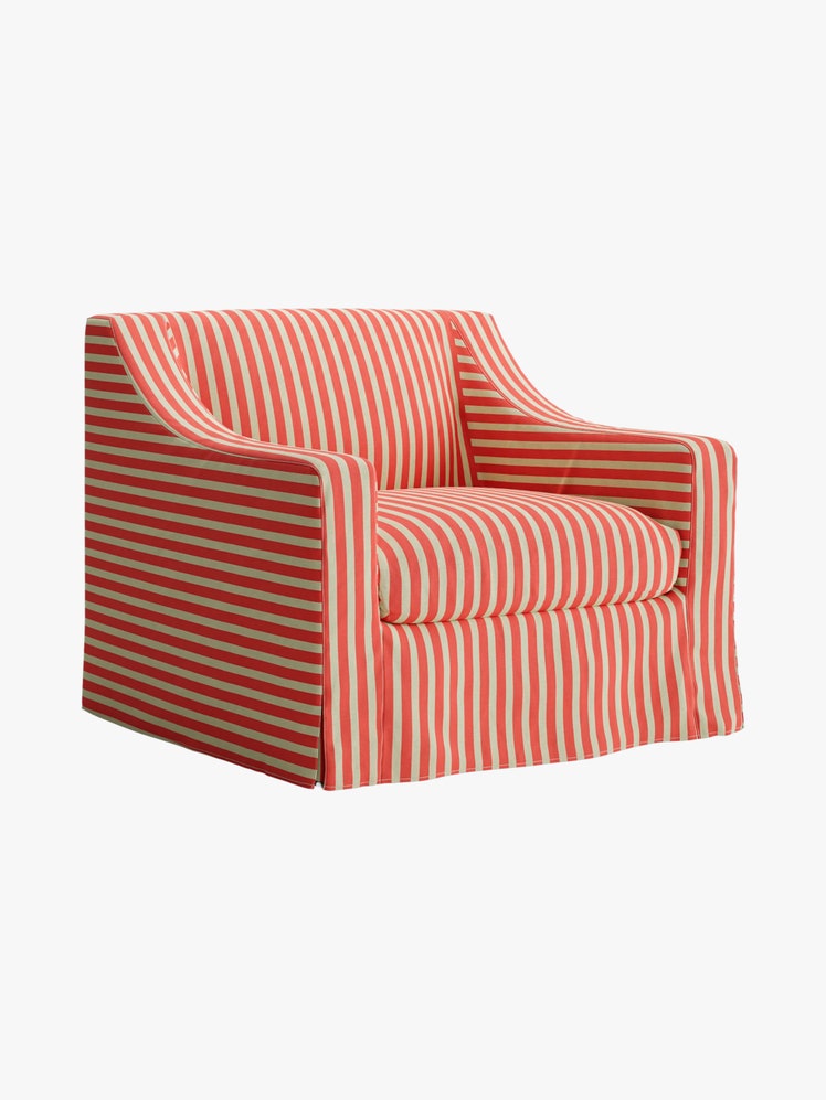 Square armchair with sloped arms and an orange and white slipcover.