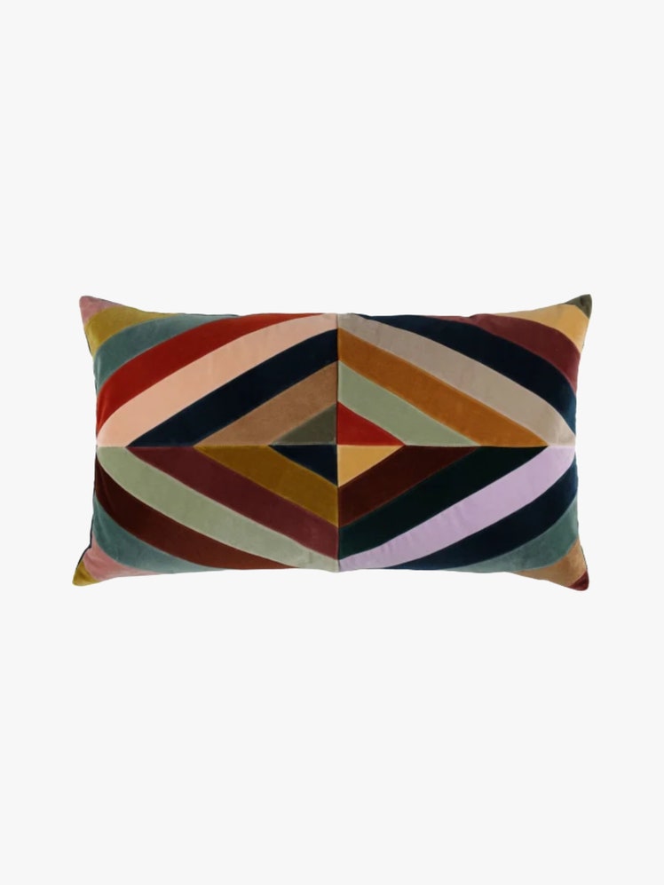 Rectangular pillow with a multicolored diagonal striped design.