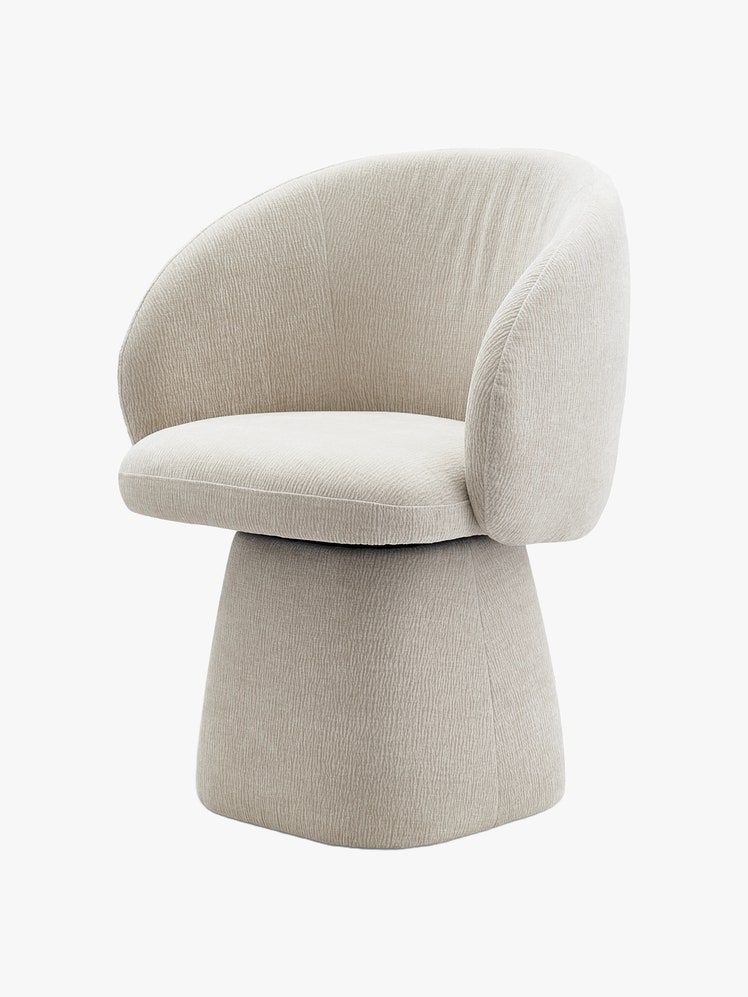 Barrelshaped swivel chair with a pedestal base all upholstered in white.