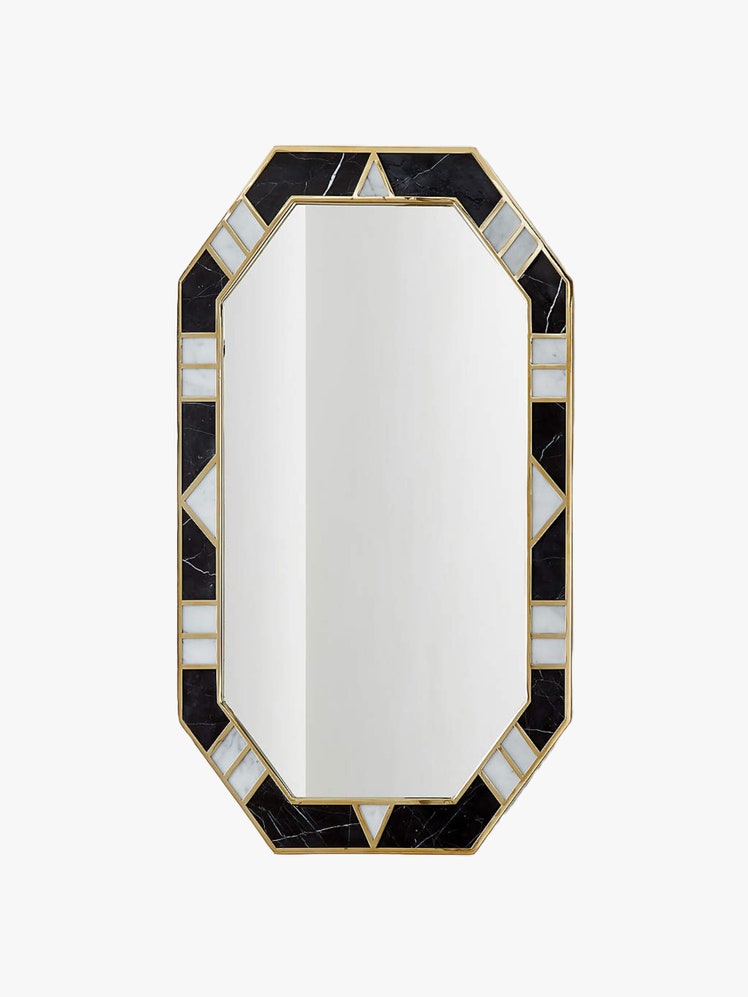 Hexagonal wall mirror in an unlacquered brass frame holding inlays of Marquina black marble and Carrara white marble.