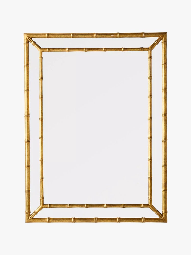 Rectangular mirror with a golden bamboo frame.