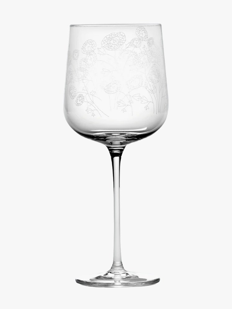 Wine glass etched with flowers.