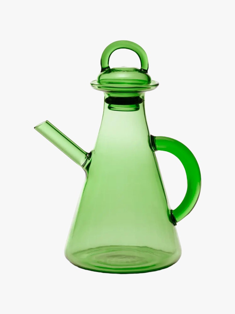 Green glass cruet with a long spout and a breather valve on the lid.