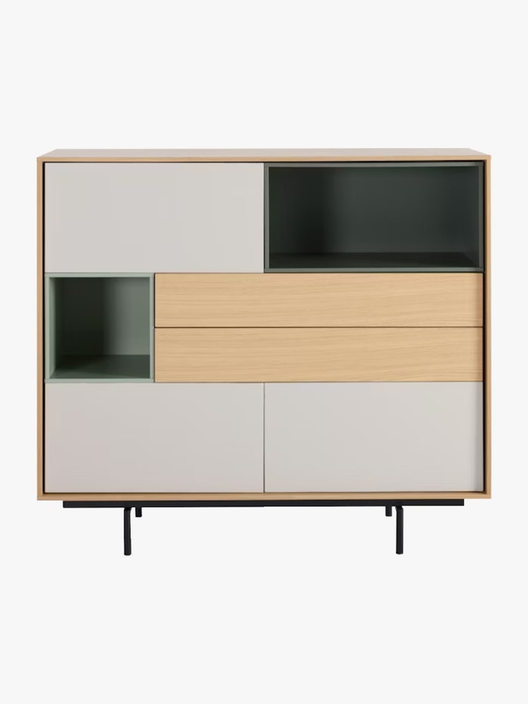 Rectangular cabinet that features two drawers three closed compartments and two open shelves in tan white and pale green.