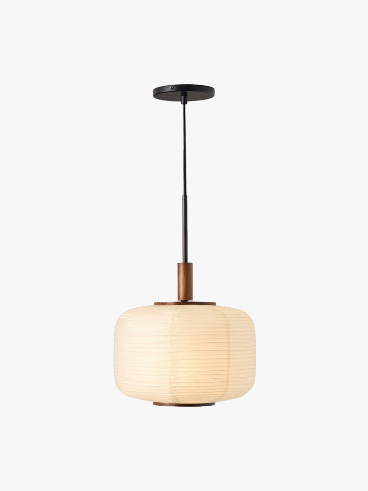 Ceiling light with brass hardware and a short cylindrical textured paper shade inspired by Japanese lanterns.