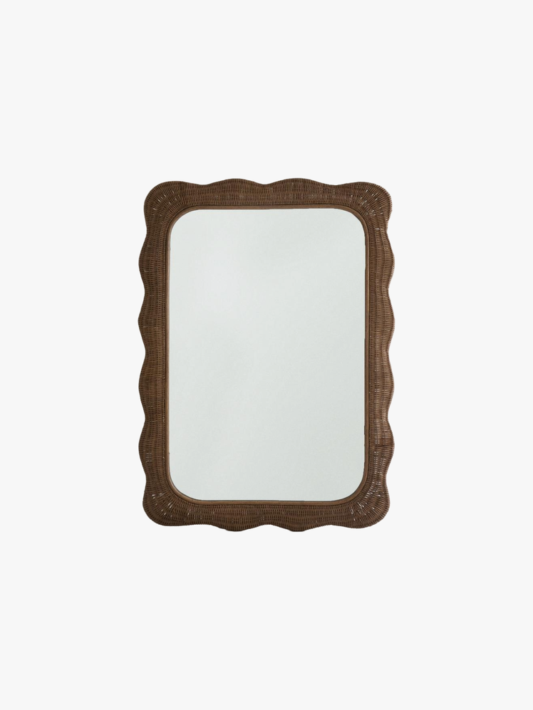 Rectangular wall mirror with a rattan frame featuring an irregular design