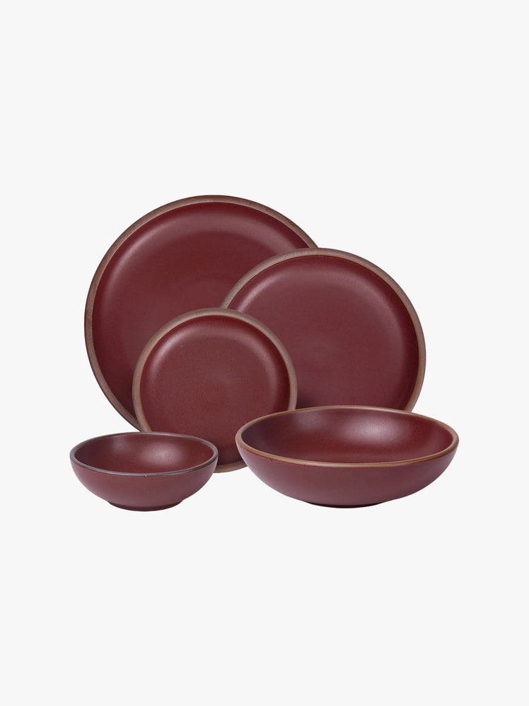 Deep red ceramic dining set including 2 bowls and 3 different size plates.