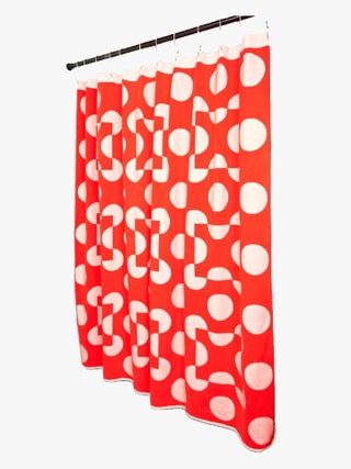 Terrycloth shower curtain in fire red with raised light pink dots.