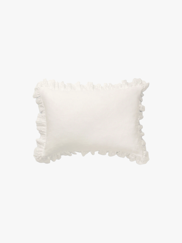 Trim Pillow Cover made of white linen with a delicate broderie border.