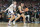 GLENDALE, ARIZONA - APRIL 08:  Zach Edey #15 of the Purdue Boilermakers tries to get around Donovan Clingan #32 of the Connecticut Huskies during the National College Basketball Championship game at State Farm Stadium on April 08, 2024 in Glendale, Arizona.  (Photo by Mitchell Layton/Getty Images)