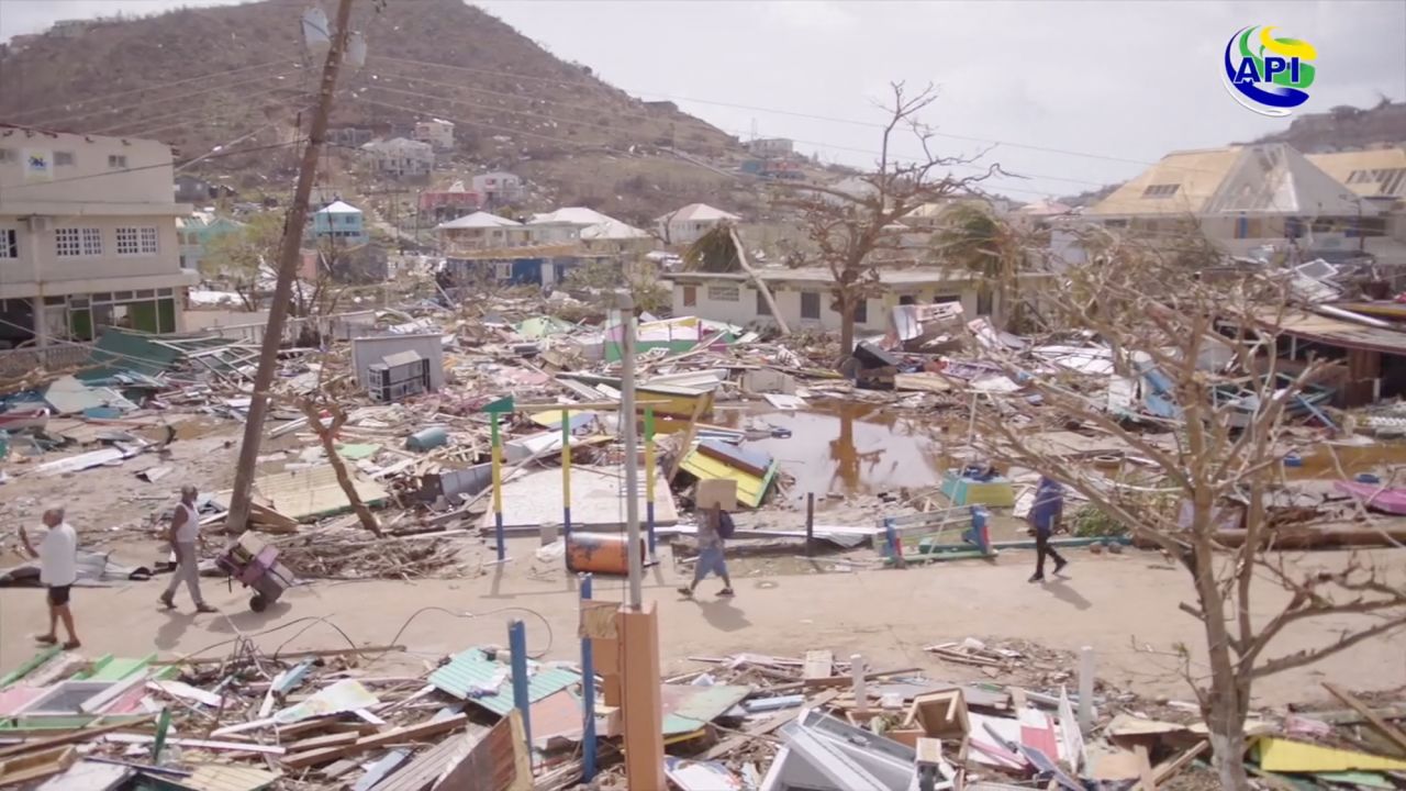 People walk amidst damaged property following the passing of Hurricane Beryl, in Union Island, Saint Vincent and the Grenadines, in this screen grab taken from a handout video released on July 2.