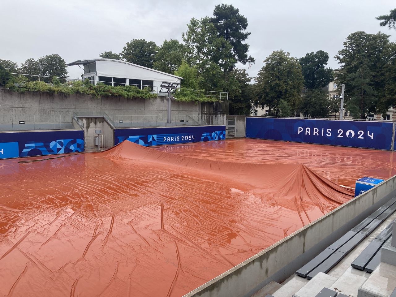 A tennis court at Roland Garros in Paris is covered on July 27.