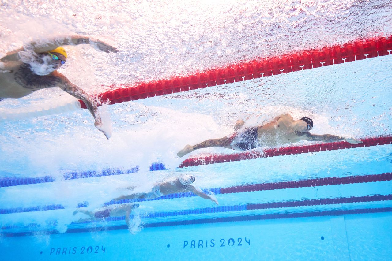 American swimmer Caeleb Dressel, right, competes in the men's 4x100-meter freestyle relay final at La Défense Arena in Nanterre, France, on July 27. 