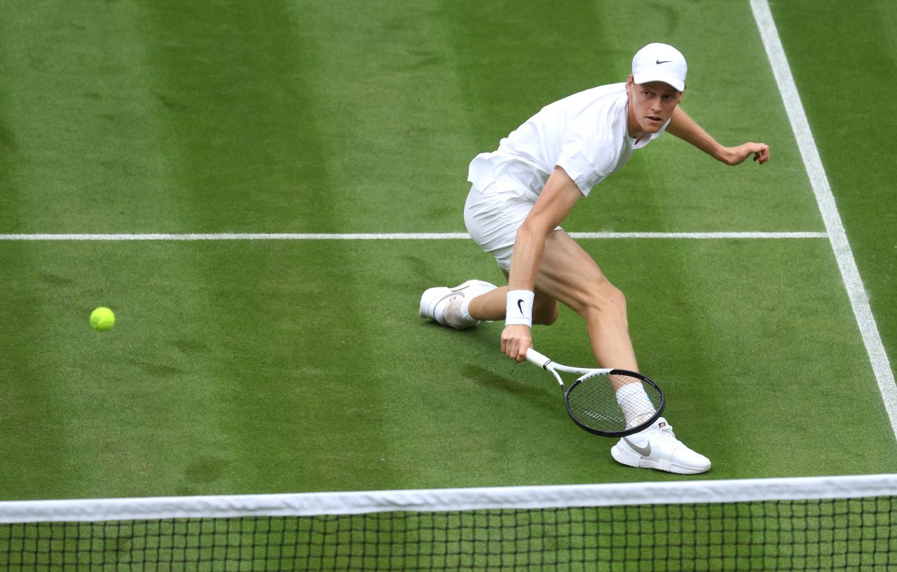 Jannick Sinner slides to play a backhand against Yannick Hanfmann at the first round match at the Wimbledon Tennis Championships in London on July 1. 