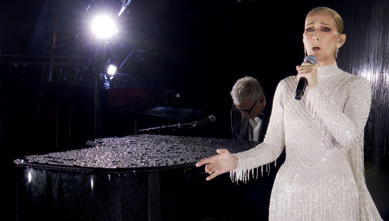 Canadian singer Celine Dion performs Edith Piaf’s “Hymne À L’Amour,” one of the French singer’s most well-known songs, on the Eiffel Tower at the end of the ceremony. 