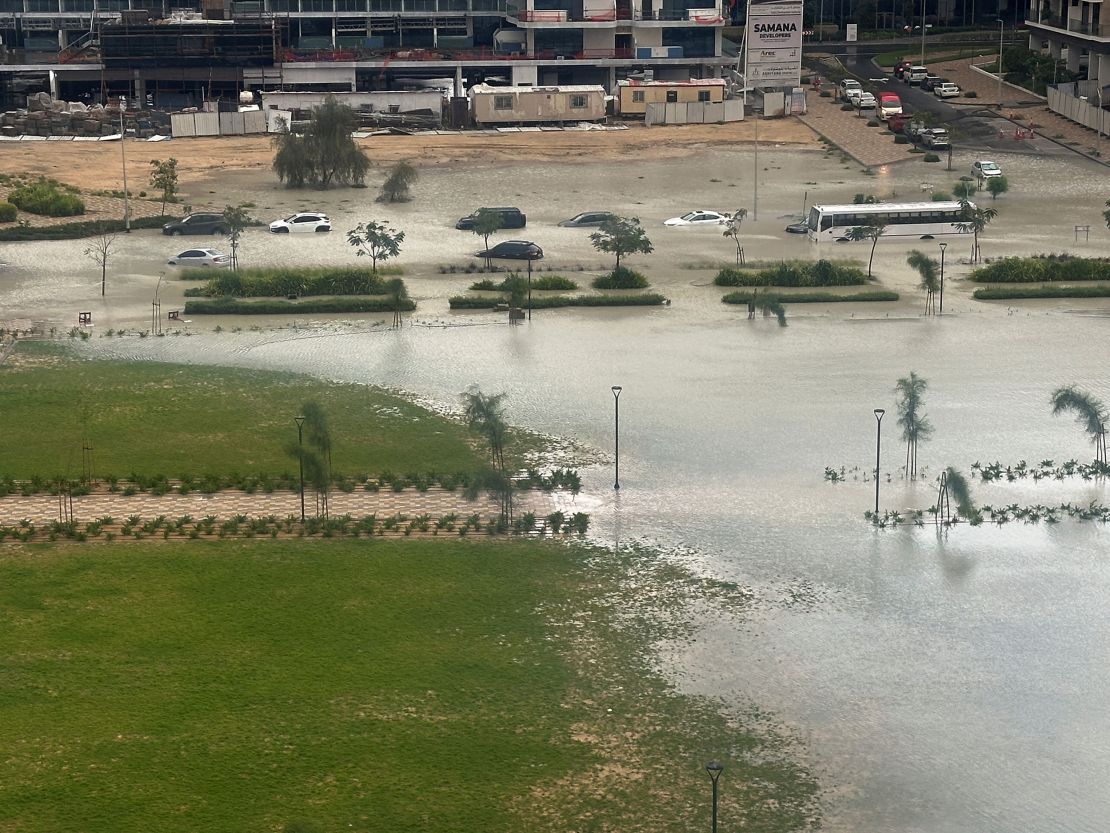 Cars drive through a flooded street in Dubai, United Arab Emirates, Tuesday.