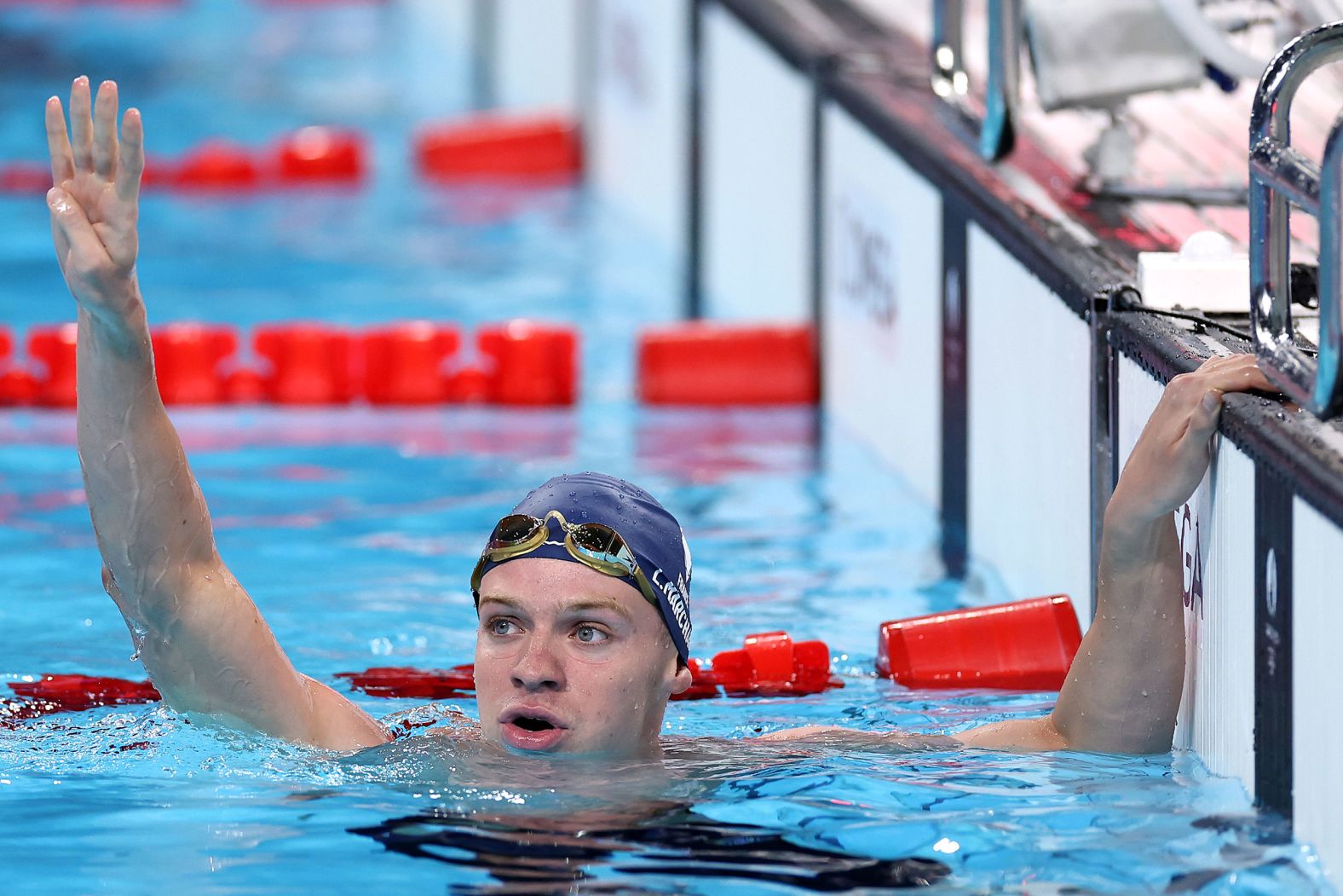 France's Léon Marchand celebrates after winning the 200-meter individual medley on Friday, August 2. It was his <a href="https://www.cnn.com/sport/live-news/paris-olympics-news-2024-08-02-24#h_fa357fc33aa32c725d7eabcf09658000">fourth gold medal of the Games</a>, and he finished with an Olympic-record time of 1:54.06.