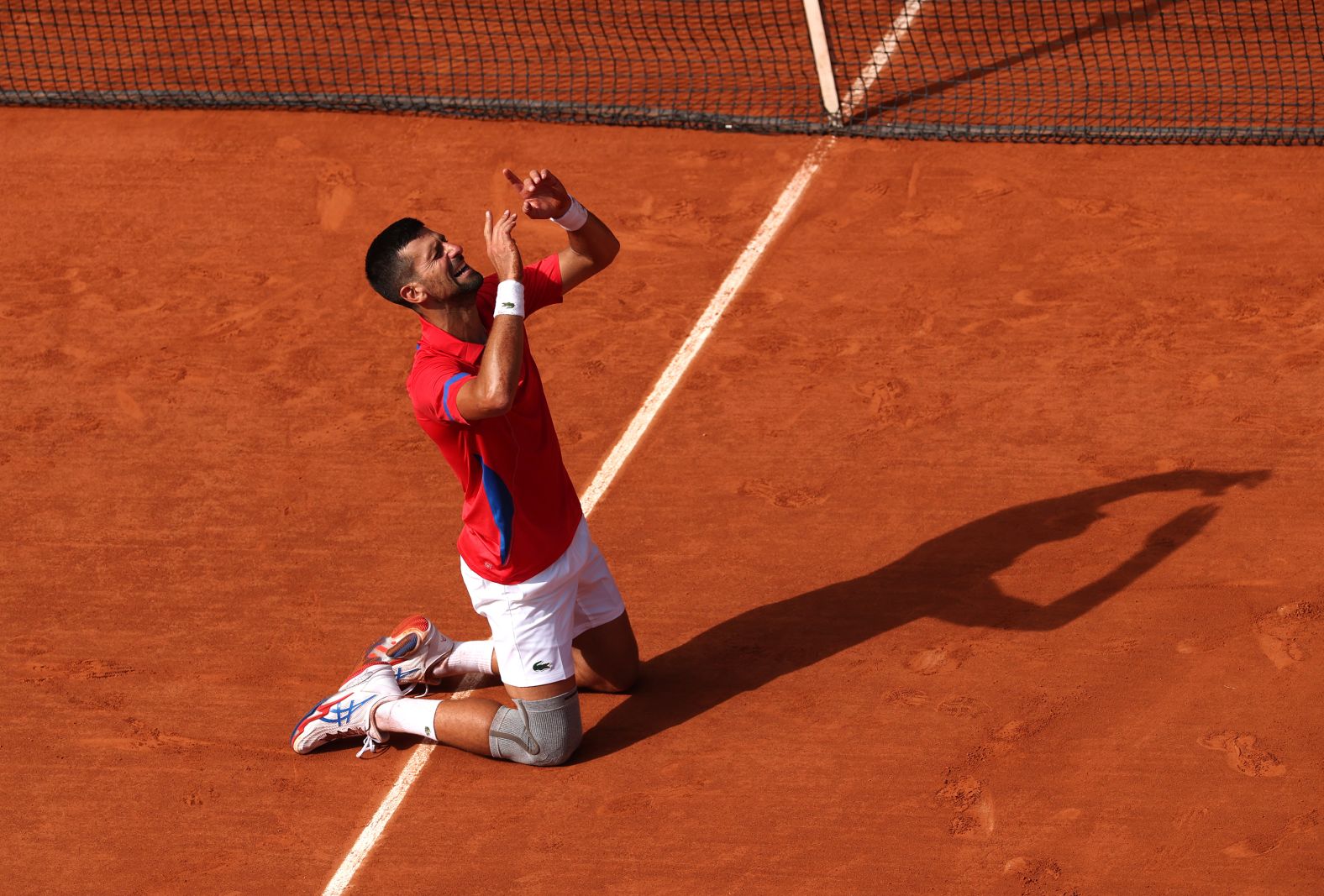 Serbia's Novak Djokovic celebrates after he defeated Spain's Carlos Alcaraz to win gold on August 4. It was <a href="https://www.cnn.com/2024/08/04/sport/novak-djokovic-carlos-alcaraz-paris-olympics-tennis-spt-intl/index.html">the first gold medal for Djokovic</a>, who has won a record 24 grand slam singles titles during his legendary career.