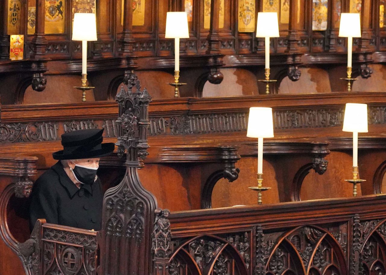 Queen Elizabeth II takes her seat for the funeral service of Britain's Prince Philip, Duke of Edinburgh inside St George's Chapel in Windsor Castle in Windsor, England, on April 17.