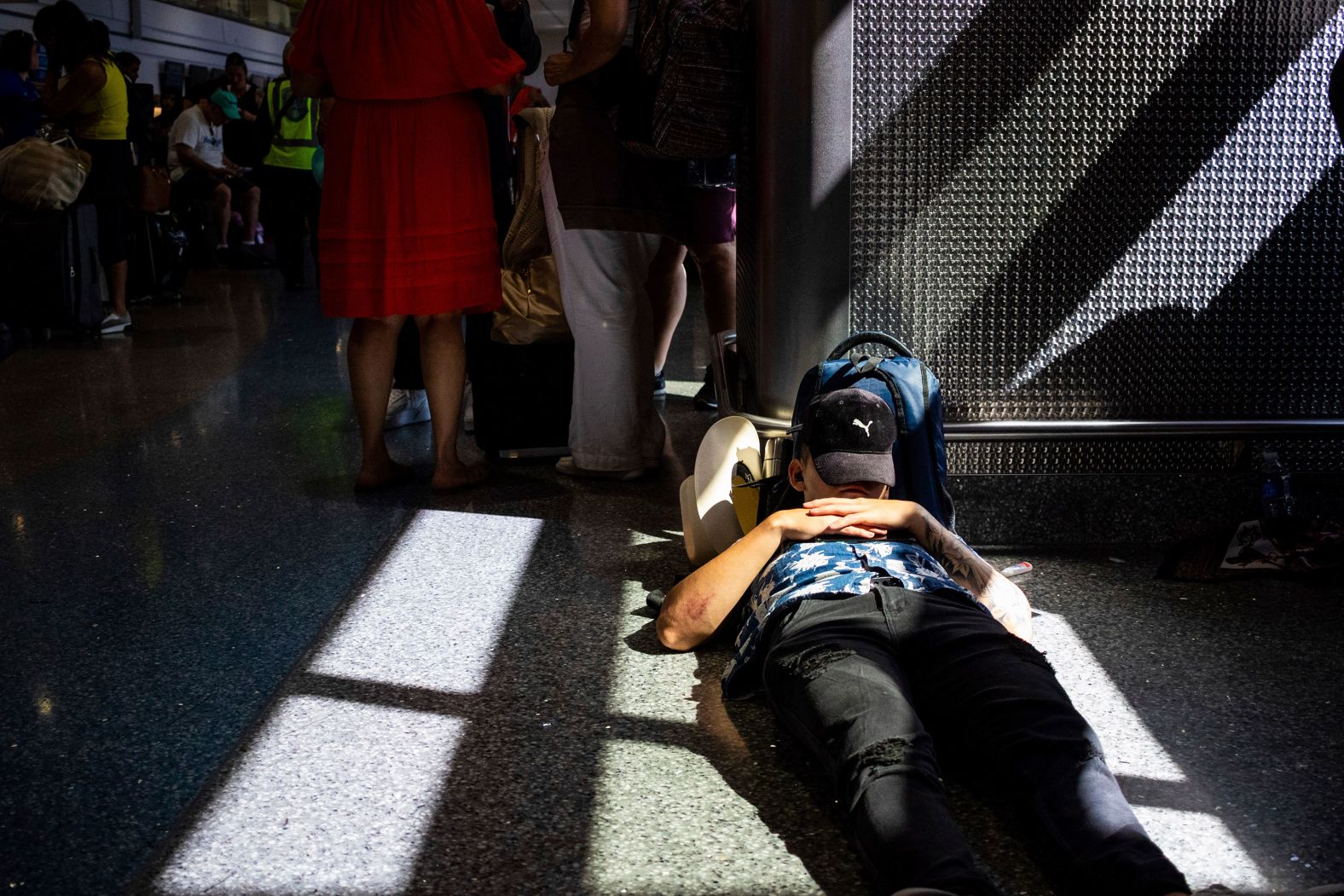 A passenger takes a nap inside a terminal at Las Vegas’ Harry Reid International Airport on Friday, July 19. Many flights into and out of the United States were canceled Friday after a <a href="https://www.cnn.com/business/live-news/global-outage-intl-hnk/index.html">global computer outage</a> affected airports, banks and other businesses.