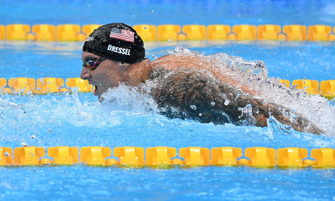 USA's Caeleb Dressel competes to take gold and set a new World Record in the final of the men's 100m butterfly swimming event during the Tokyo 2020 Olympic Games at the Tokyo Aquatics Centre in Tokyo on July 31, 2021.