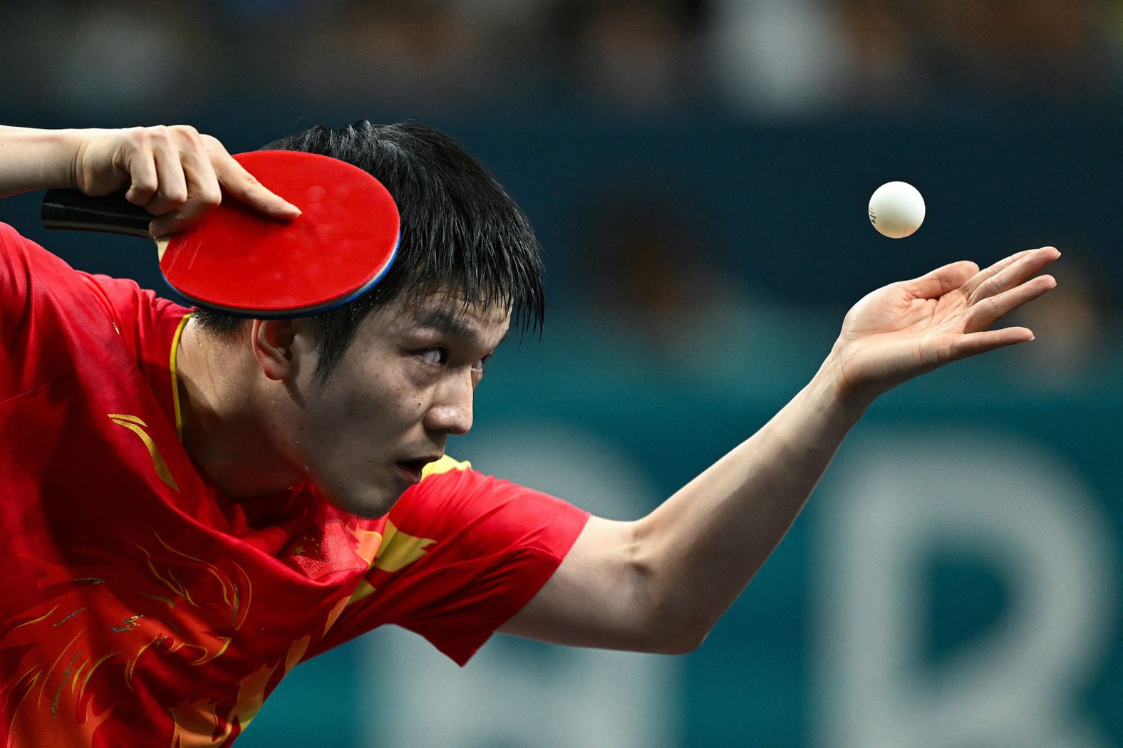 Chinese table tennis player Fan Zhendong serves to Sweden’s Truls Möregårdh during the final of men's singles on August 4. <a href="https://www.cnn.com/sport/live-news/paris-olympics-news-2024-08-04#h_67fb979428e918ce0a6a74ab9201edf8">Fan won 4-1</a>.