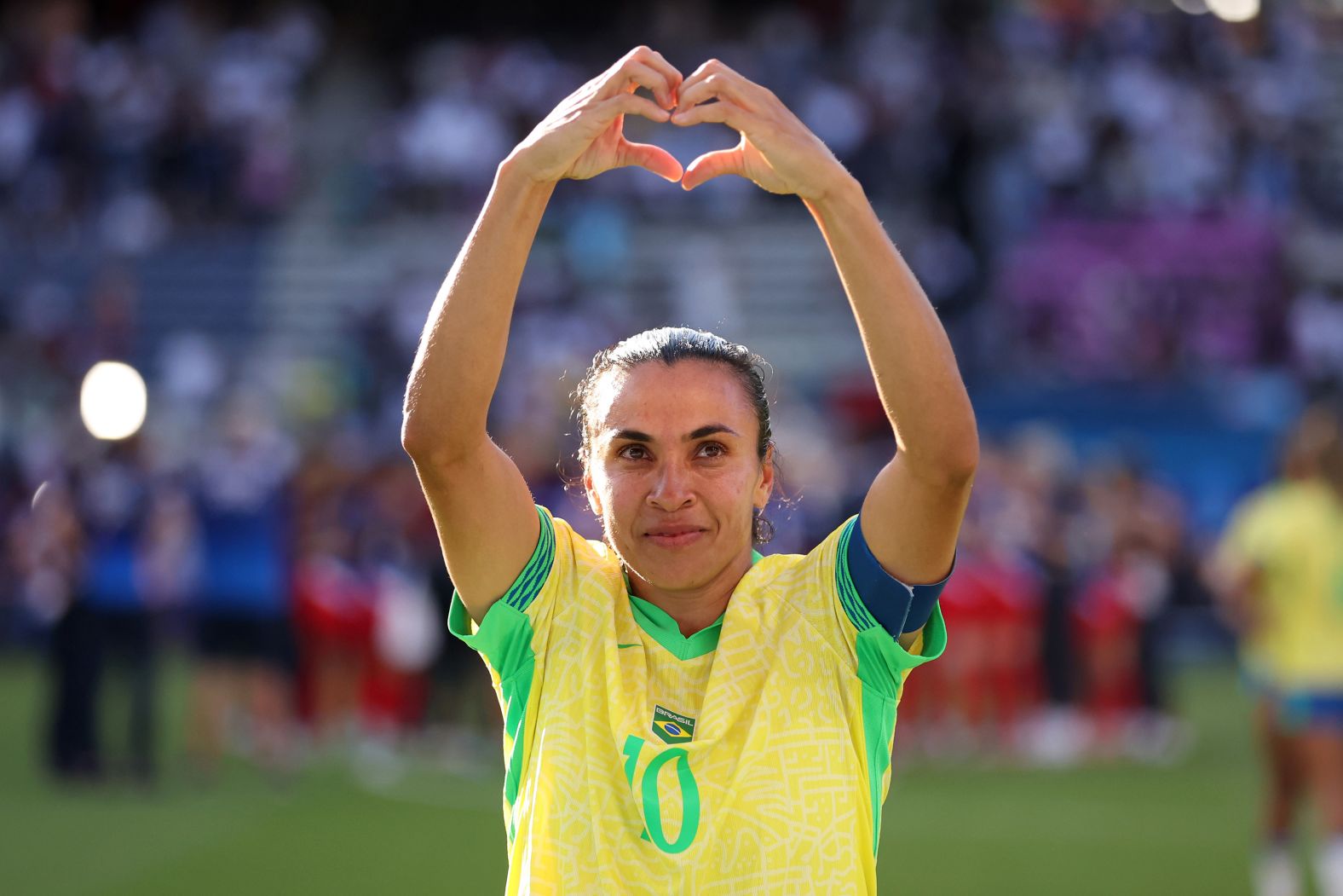 Brazilian soccer legend <a href="https://www.cnn.com/sport/live-news/paris-olympics-news-2024-08-10#h_a305635ac203a3cbc80e89b9a63ff589">Marta</a> acknowledges the fans after the game against the United States on August 10. This was her last major appearance for her country.