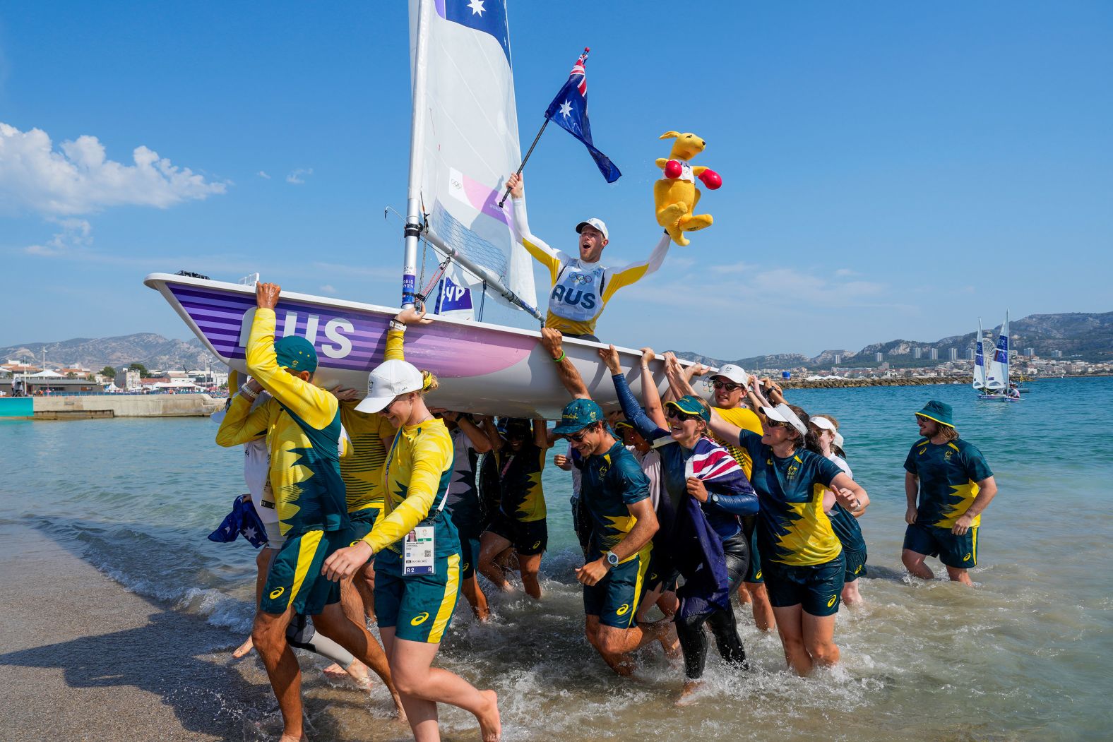 Australia's Matt Wearn celebrates after <a href="https://www.cnn.com/sport/live-news/paris-olympics-news-2024-08-07#h_1842d96d7e8404a5447790c4cfb37060">winning gold in a dinghy sailing race</a> on August 7.