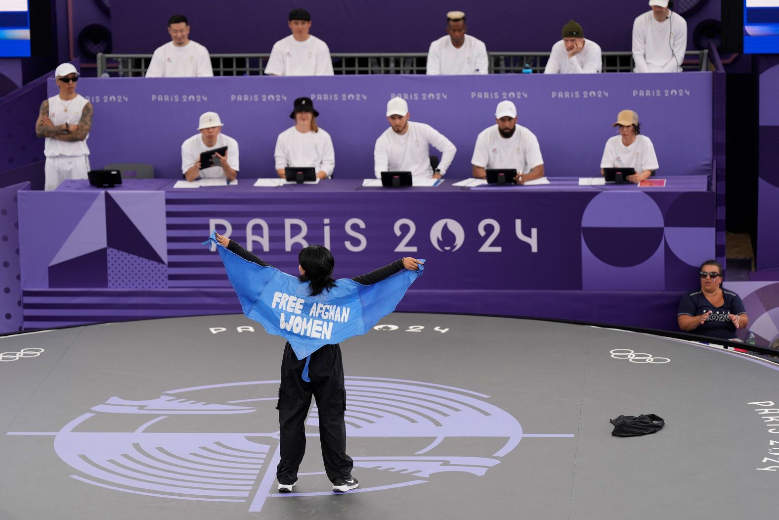 Manizha Talash <a href="https://www.cnn.com/sport/live-news/paris-olympics-news-2024-08-09#h_e99c738431cb8d6570d71599832f2bcc">wears a cape that says "free Afghan women"</a> as she takes part in the breaking competition on August 9. The 21-year-old fled Afghanistan after the Taliban began seizing control in 2021. She is now living in Spain, but she is representing the Refugee Team at the Olympics.