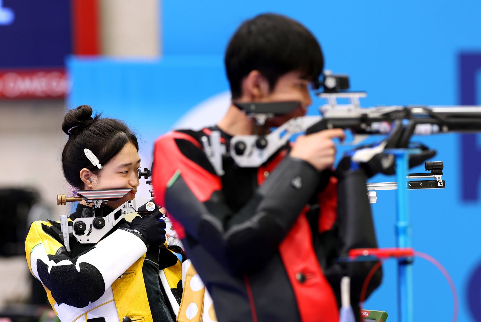 China’s Huang Yuting, left, competes in the 10-meter air rifle mixed-team shooting competition with Sheng Lihao on July 27. <a href="https://www.cnn.com/sport/live-news/paris-olympics-news-2024-07-27#h_93b948f94523253e5a87b1f0890e07ed">They won the first gold medal of the Paris Olympics</a>.