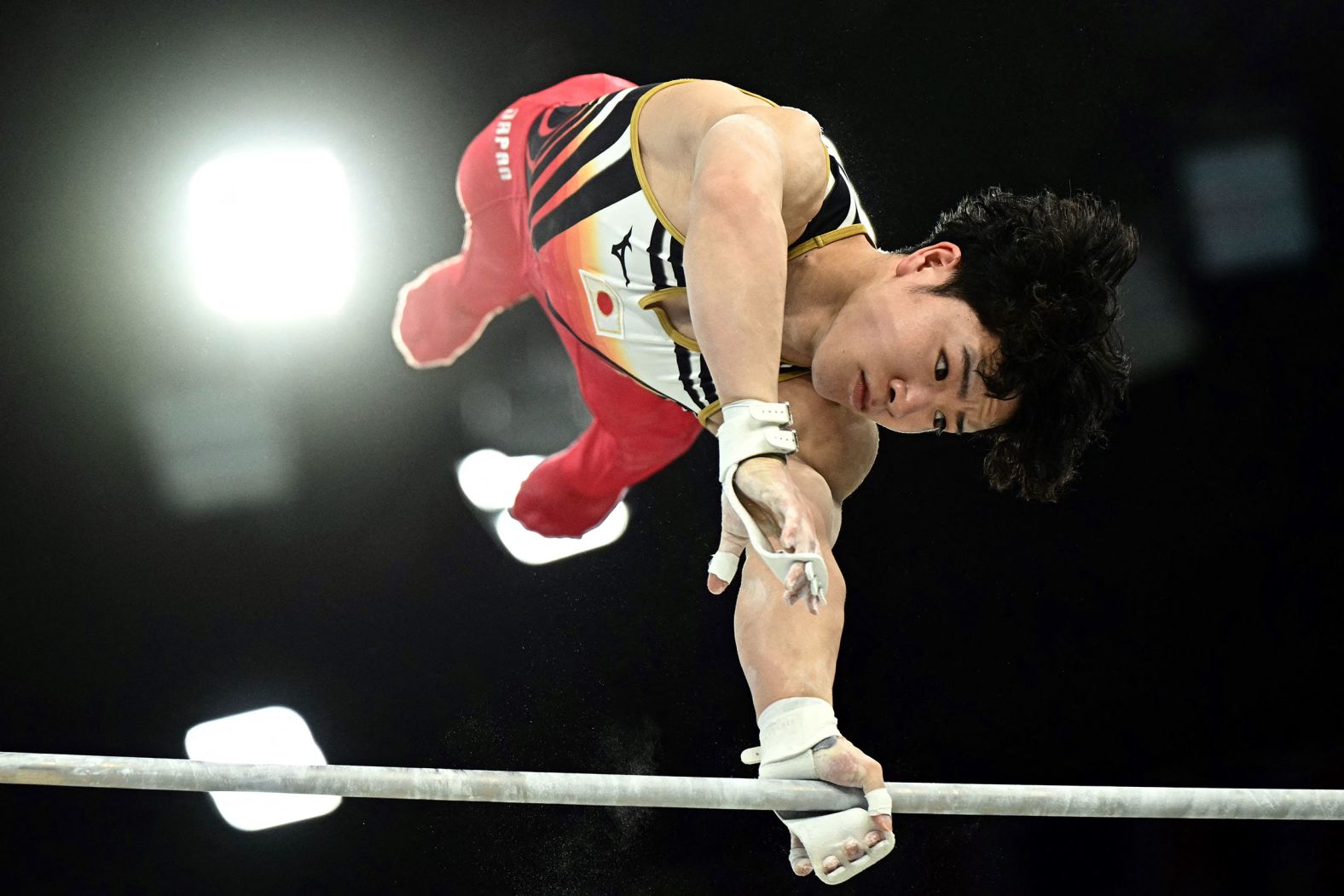 Japanese gymnast Shinnosuke Oka competes on the horizontal bar during the individual all-around on July 31. <a href="https://www.cnn.com/sport/live-news/paris-olympics-news-2024-07-31#h_637a7ecb42ecb8a0ec28ad3117455f31">Oka went on to win the gold</a>. Japanese men have now won the individual all-around in four straight Olympics. Daiki Hashimoto won three years ago in Tokyo, and Kohei Uchimura won in 2016 and 2012.