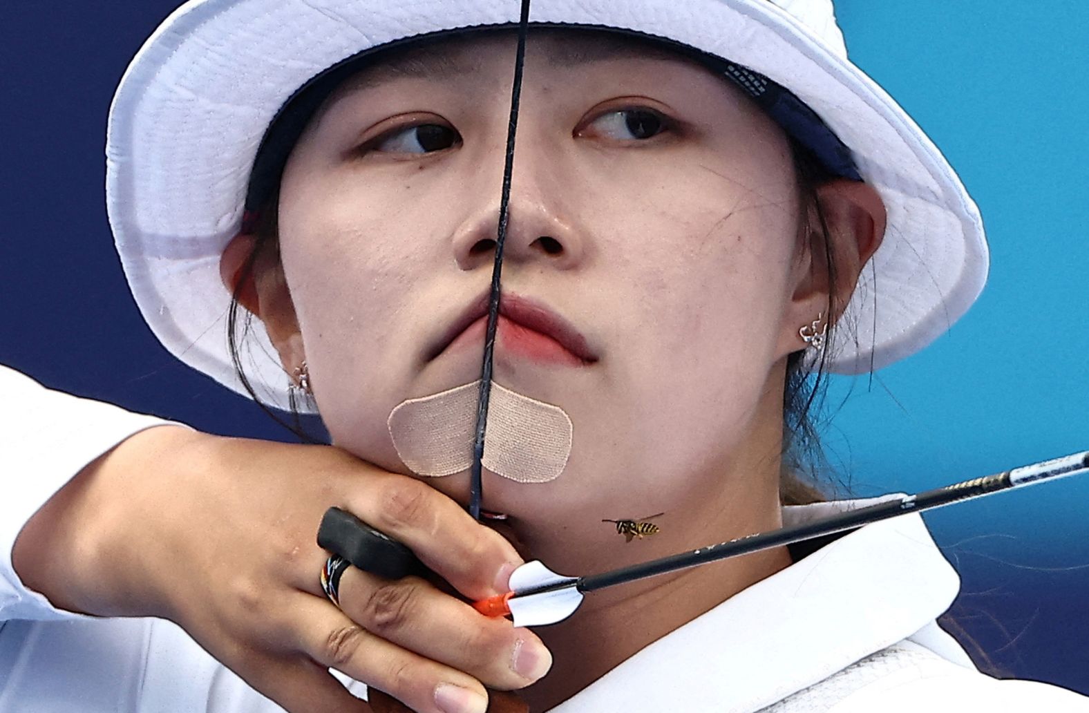 A bee flies near South Korean archer Lim Si-hyeon on August 3. <a href="https://www.cnn.com/sport/live-news/paris-olympics-news-2024-08-03#h_37b532ff67fdf499af43166393ec157c">She won the individual event</a> for her third gold medal in Paris.