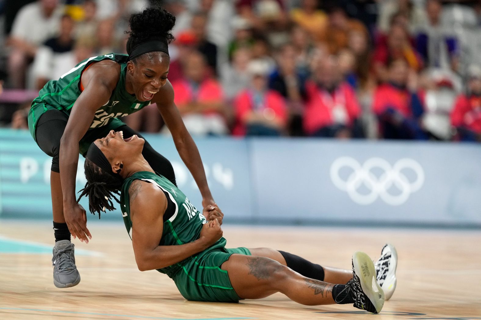 Nigerian basketball players Promise Amukamara, left, and Ezinne Kalu celebrate during their game against Canada on August 4. With a 79-70 win, <a href="https://www.cnn.com/sport/live-news/paris-olympics-news-2024-08-04#h_f985176354f9a228c3c53f8de80a3d4b">Nigeria made history</a> by becoming the first African team — men’s or women’s — to reach the quarterfinal stage of the Olympics.