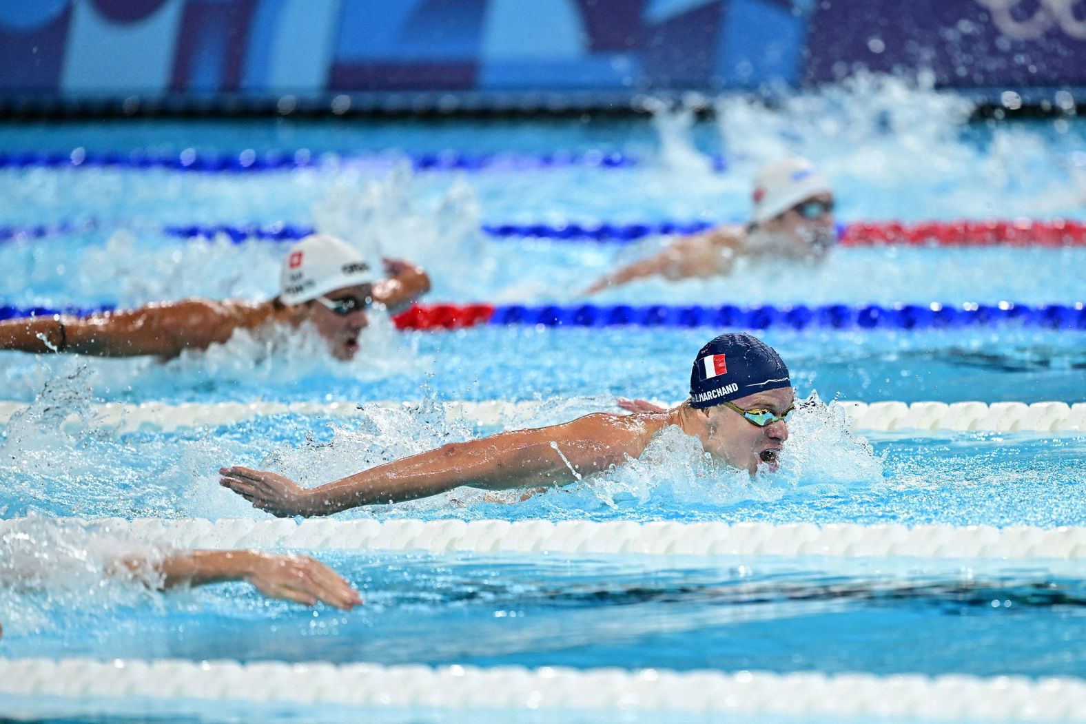 France's Léon Marchand leads the 200-meter butterfly final on July 31. <a href="https://www.cnn.com/sport/live-news/paris-olympics-news-2024-07-31#h_808414b823b308fc5e9233764590b359">Marchand won the event</a> and then came back to the pool later in the night <a href="https://www.cnn.com/sport/live-news/paris-olympics-news-2024-07-31#h_eb479960d61f000e916e9894275a9ccd">to win gold in the 200-meter breaststroke</a>. He set Olympic records in both.