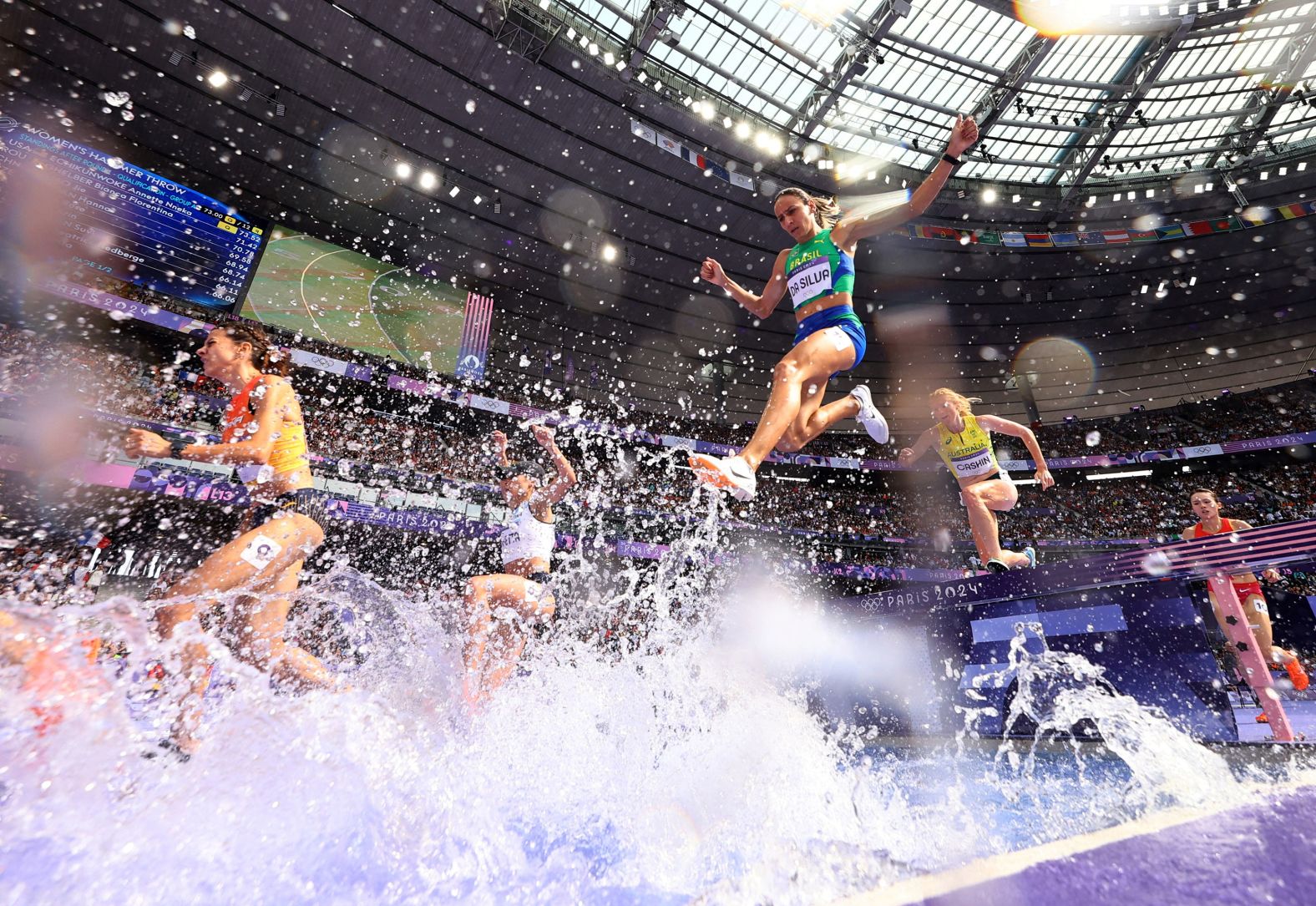 Athletes compete in the 3,000-meter steeplechase on August 4.